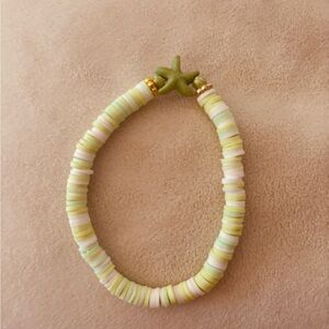 Green bracelet giving surfer vibes with the cutest GREEN STARFISH